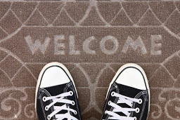 welcome mat with shoes on it