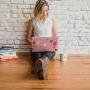 woman on floor with computer