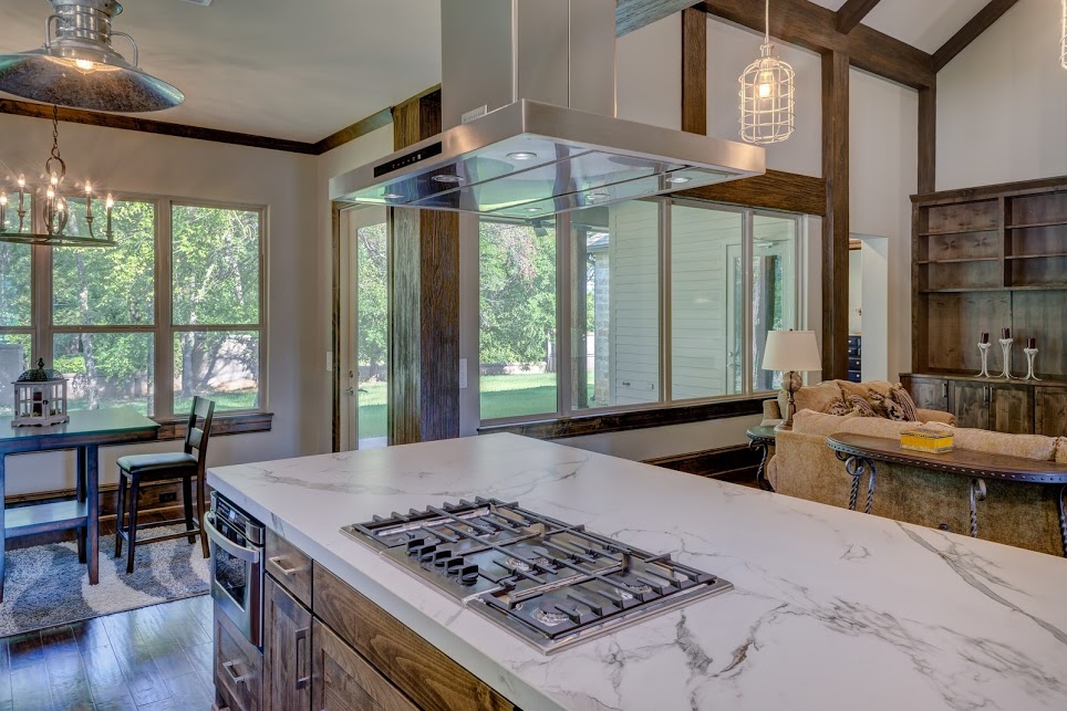 remodeled kitchen with stove in the kitchen island